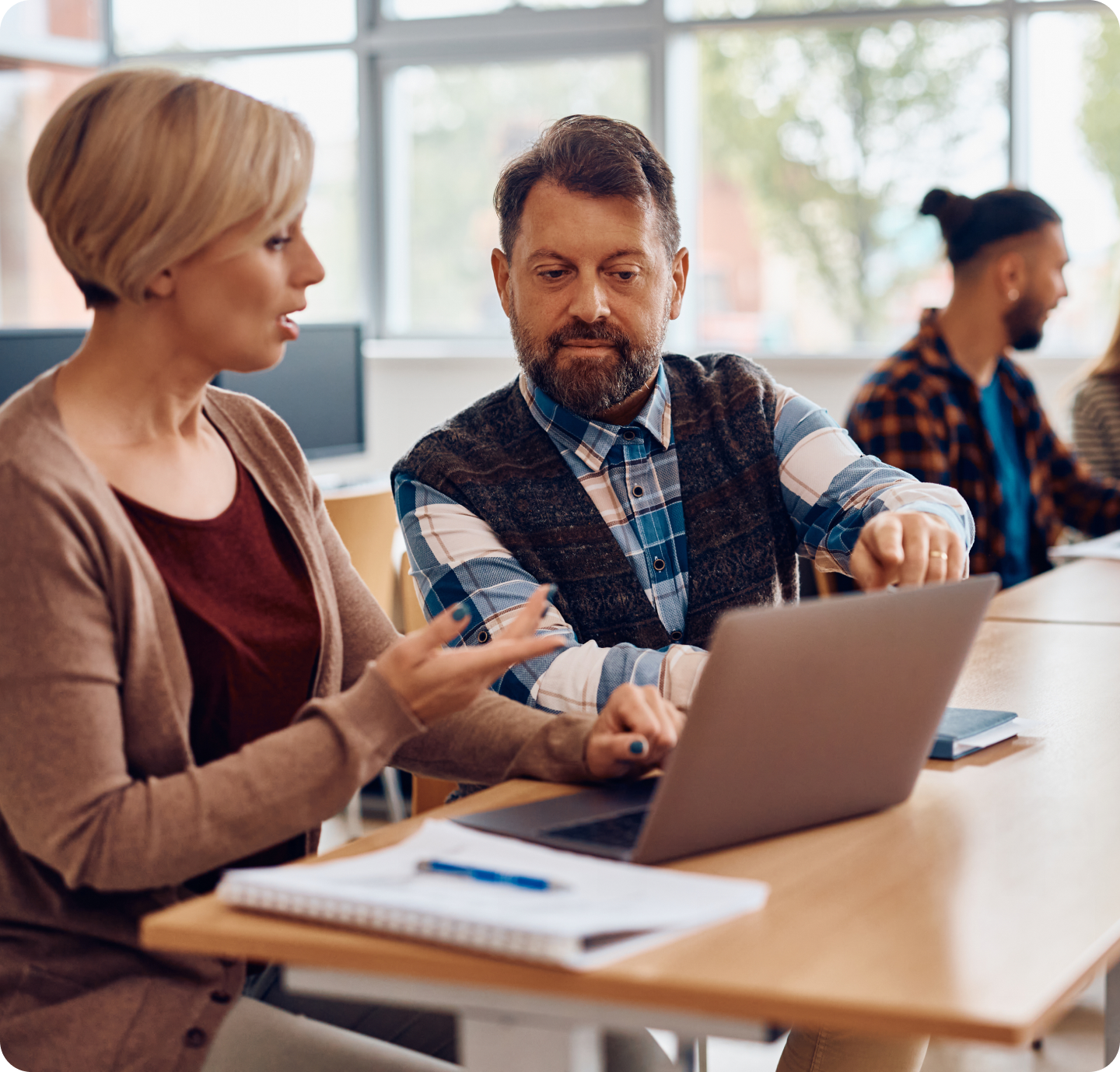 Professionals collaborating in modern office